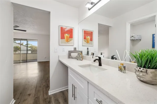 a bathroom with sink and mirror