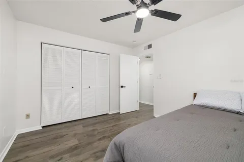 a view of a room with wooden floor and windows