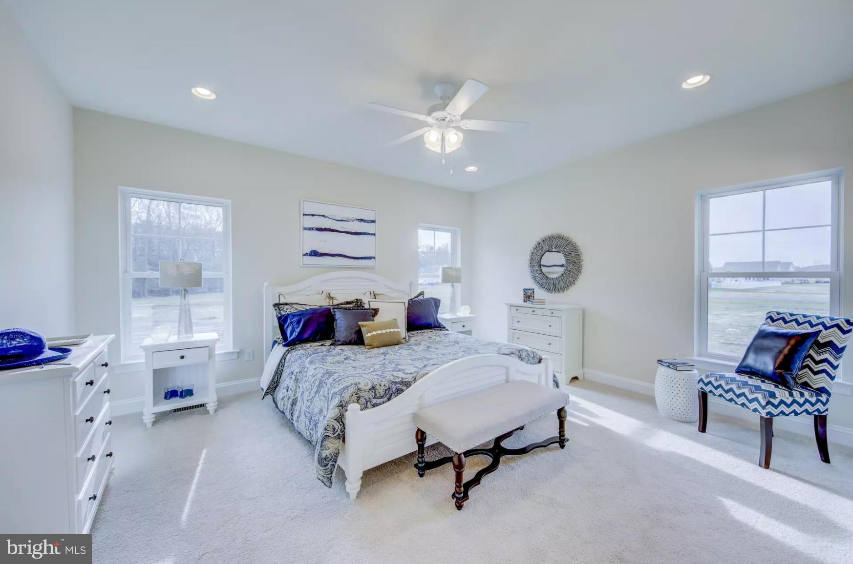 190 Windjammer Road Ocean Pines, MD 21811 - Photo 14 of 17 a bedroom with a bed a chandelier fan and a window