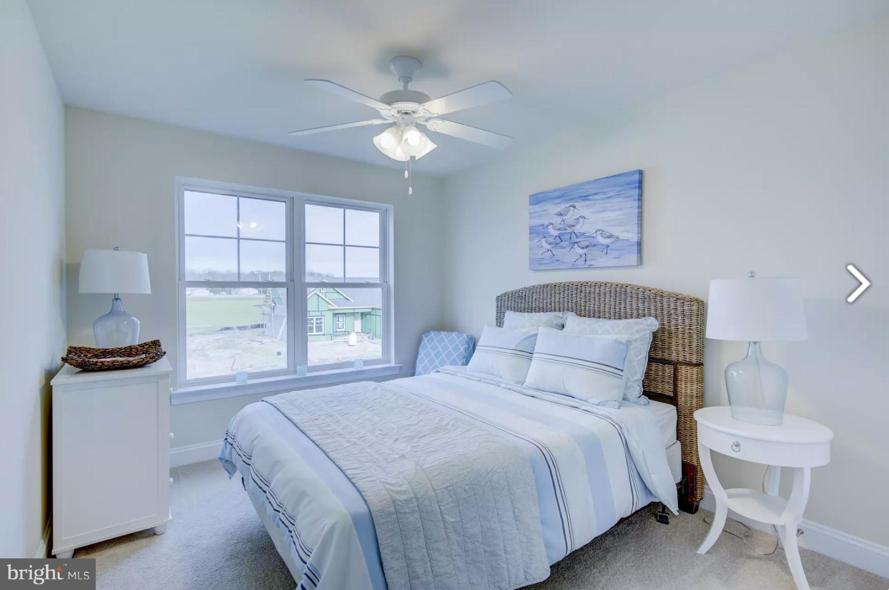 190 Windjammer Road Ocean Pines, MD 21811 - Photo 8 of 17 a bedroom with a bed and a table