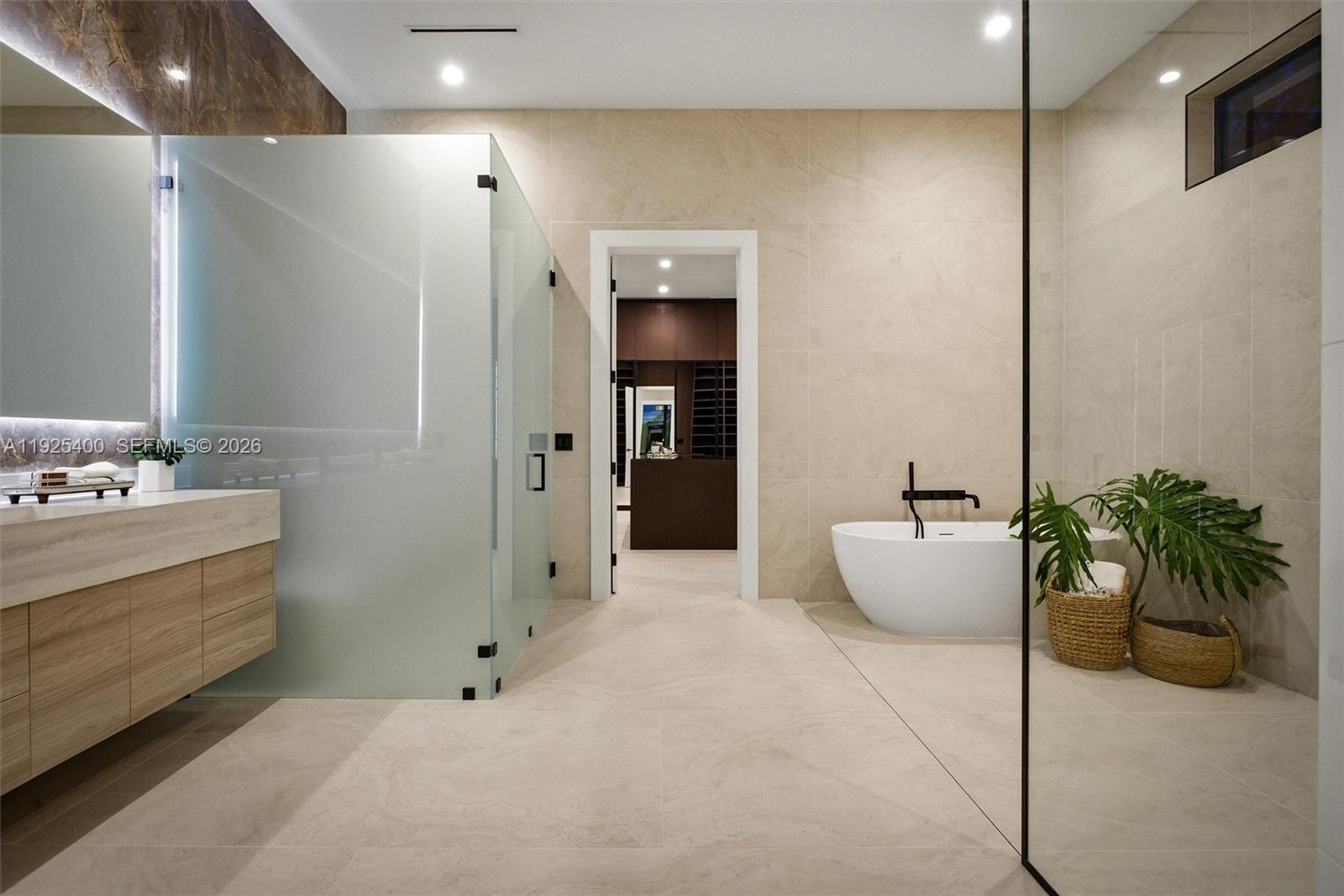 9840 Southwest 73rd Court Pinecrest, FL 33156 - Photo 42 of 67 Primary Bath Detail | Freestanding Tub | Matte Black Fixtures | Marble Tile