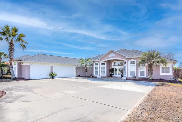 a view of a brick house with many windows
