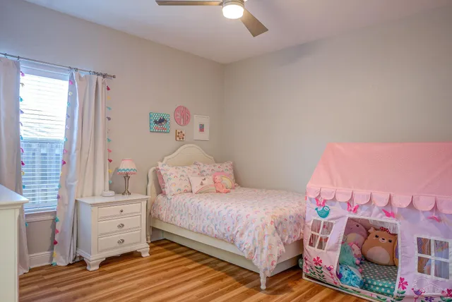 a view of a patio with dining table and chairs