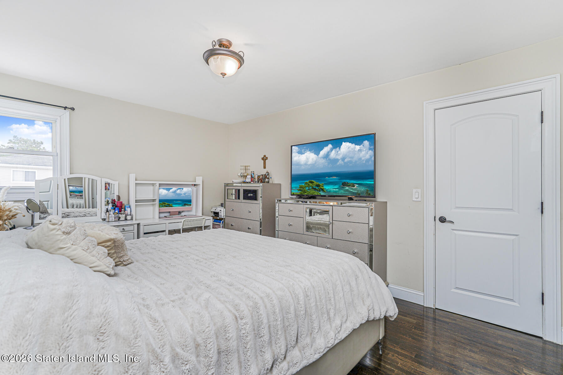 28 Drumgoole Road East Staten Island, NY 10312 - Photo 16 of 29 a bedroom with a bed and a flat screen tv