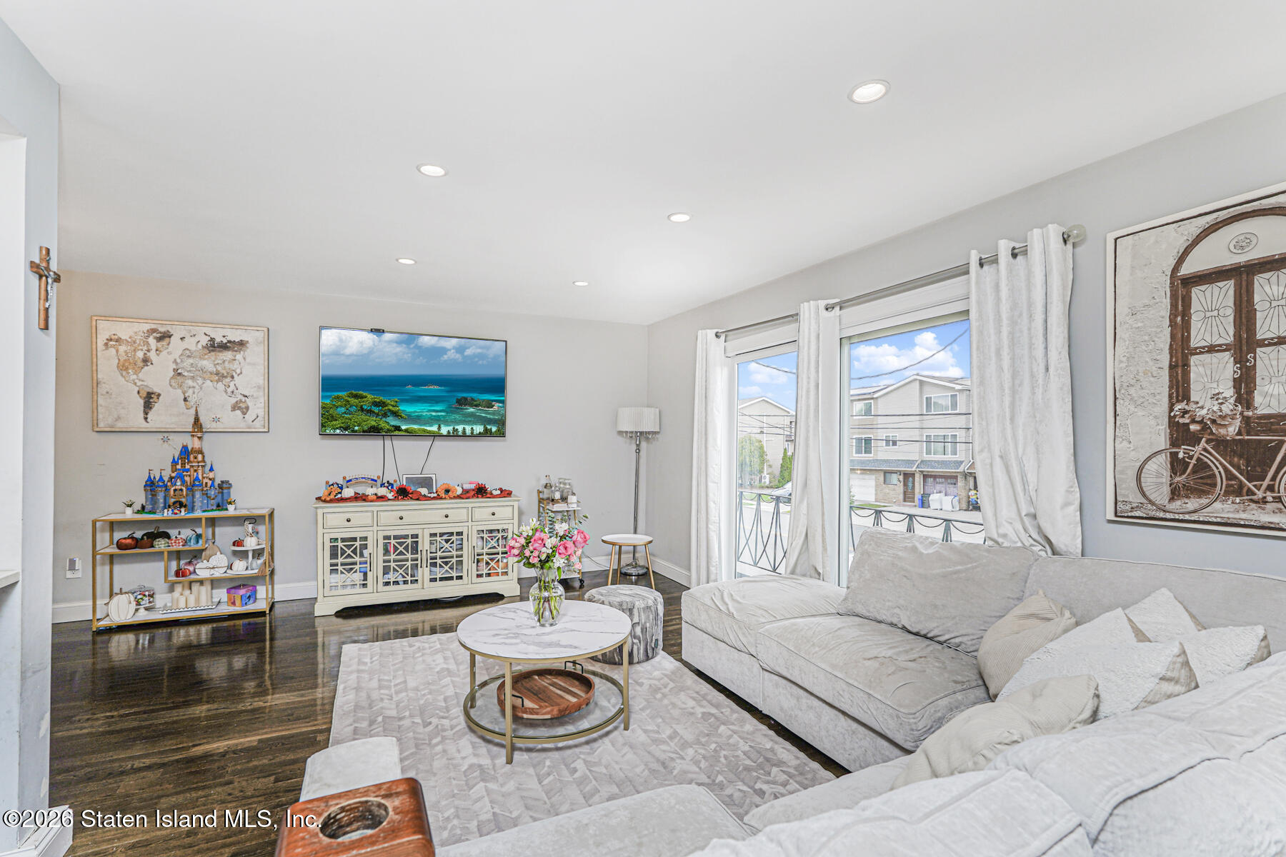 28 Drumgoole Road East Staten Island, NY 10312 - Photo 6 of 29 a living room with furniture and a flat screen tv