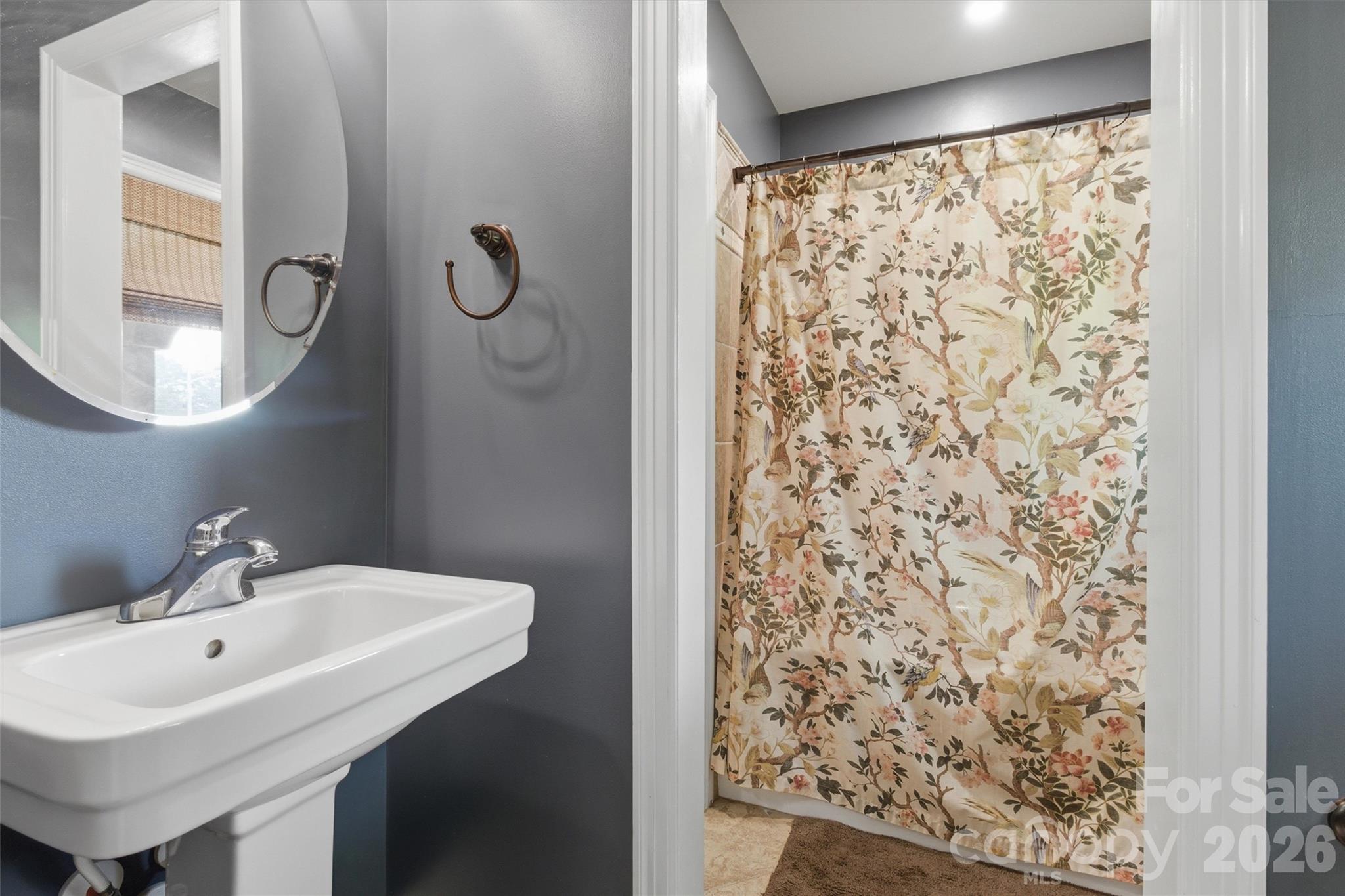 4712 Secrest Short Cut Road Monroe, NC 28110 - Photo 15 of 30 a bathroom with a shower and a sink