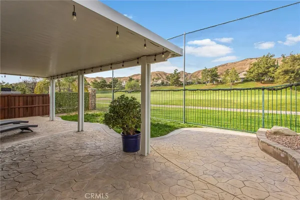a view of a garden with an outdoor seating