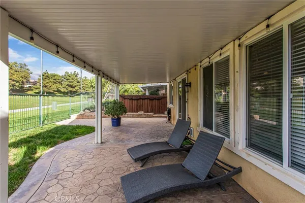 a view of a patio with a backyard