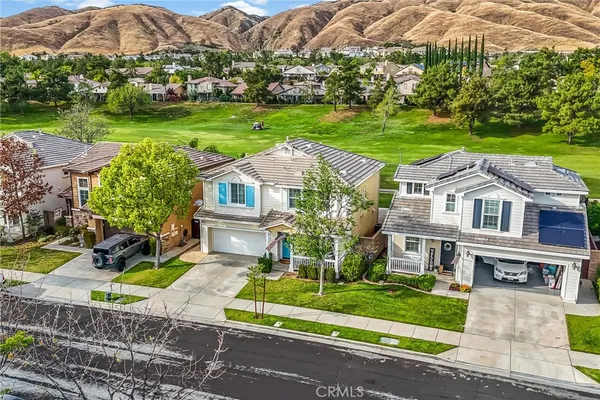 an aerial view of a house with a garden