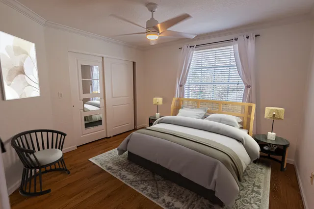 a bedroom with a bed and a window