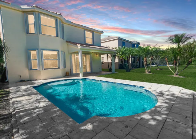 a view of a house with a swimming pool