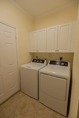 a utility room with dryer and washer