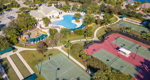 an aerial view of a house with a swimming pool