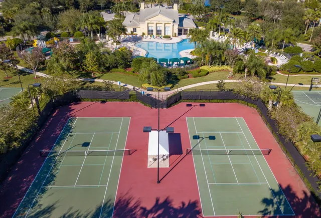 an aerial view of a houses with a yard