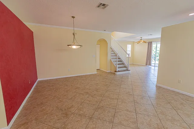 a view of a hallway with stairs