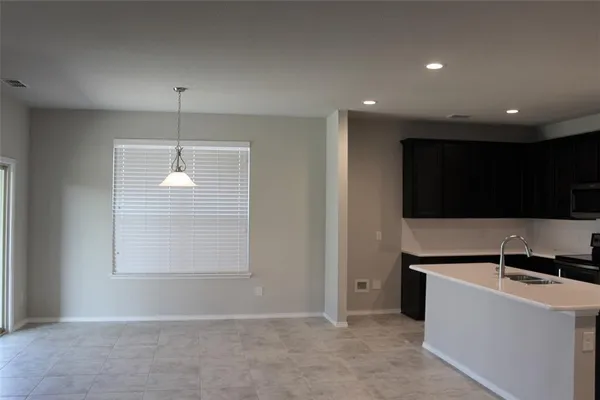 a view of a kitchen with a sink and dishwasher kitchen view