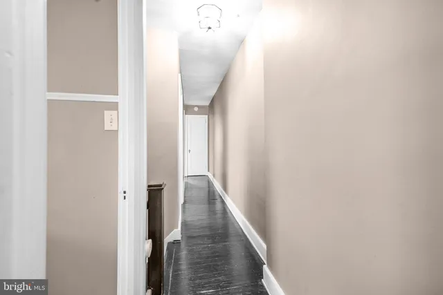 a bathroom with a sink a toilet a mirror and shower