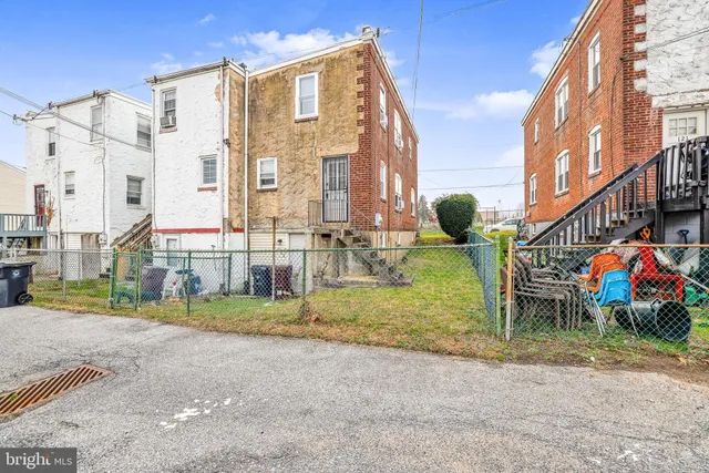 a view of a street with tall buildings