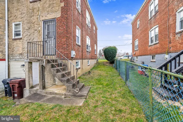 a view of an entryway with wooden floor and a ceiling fan