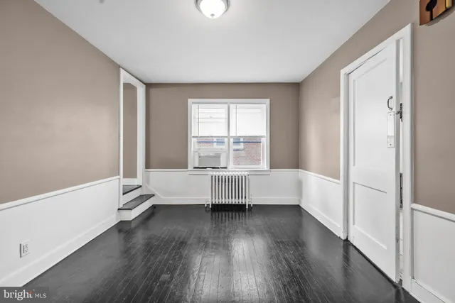 a kitchen with granite countertop white cabinets and appliances