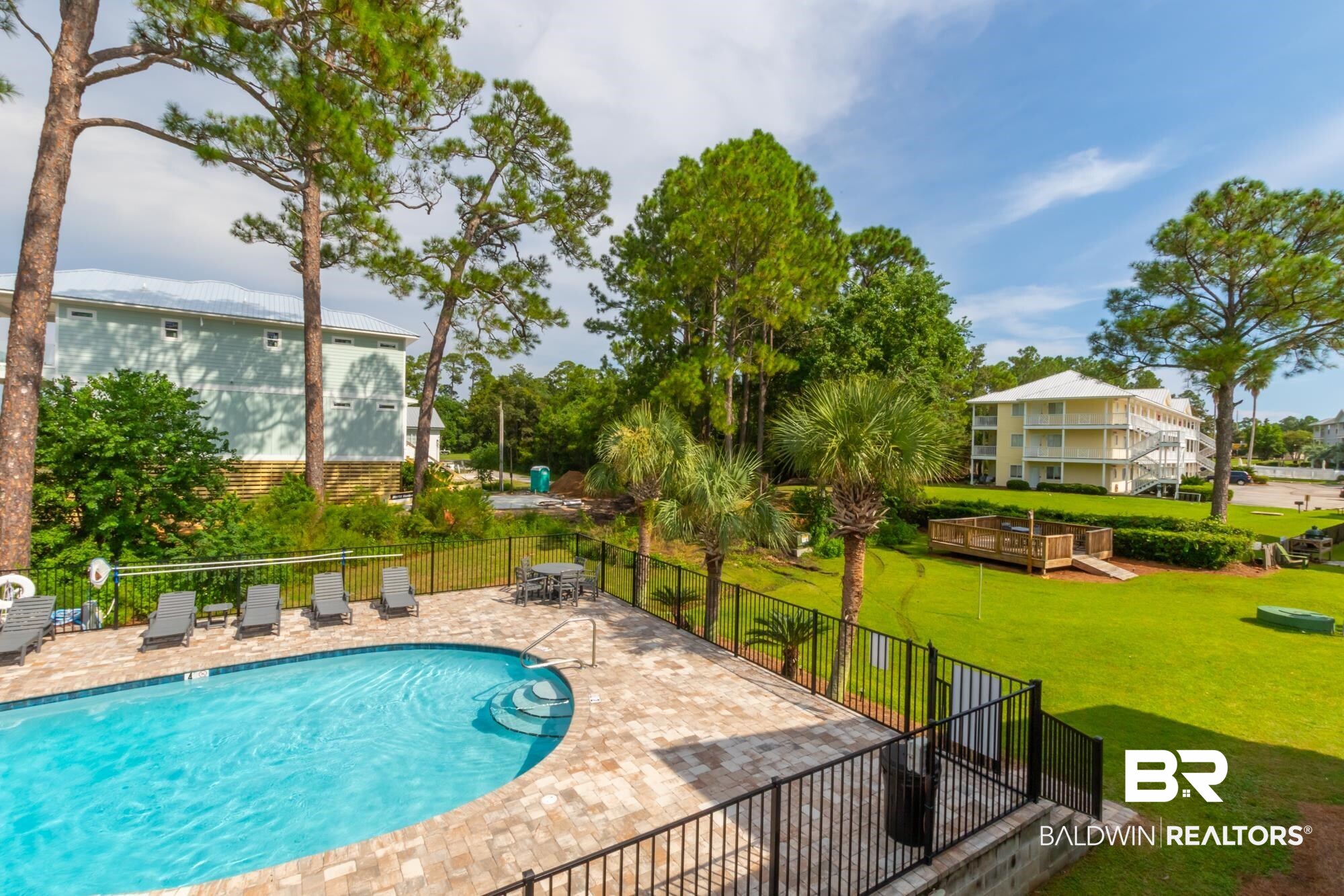 25925 -C Canal Road, Unit 203 Orange Beach, AL 36561 - Photo 28 of 57 View of pool with a yard and a patio area