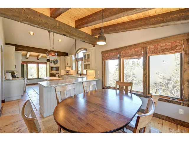 a kitchen with a sink a stove and cabinets
