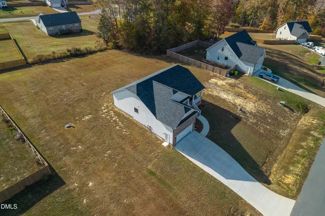 swimming pool view with a backyard space