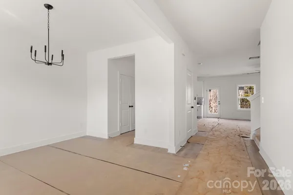 a view of a room with cabinet and hallway