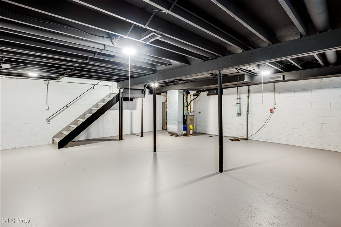 3691 Lyntz Road Warren, OH 44481 - Photo 27 of 36 Below grade area featuring stairs and heating unit