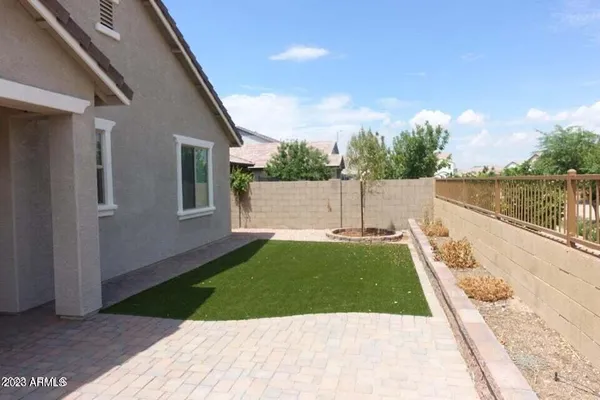 a view of a backyard of the house