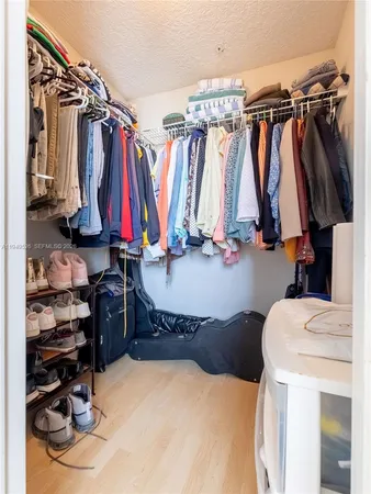 a bed room with a bed and a walk in closet