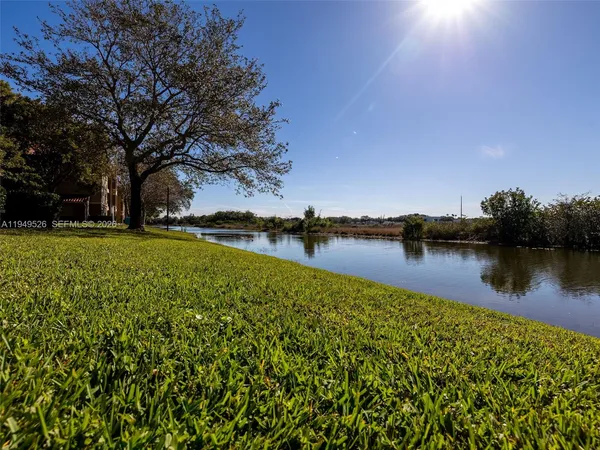 a view of a lake with houses in outdoor space