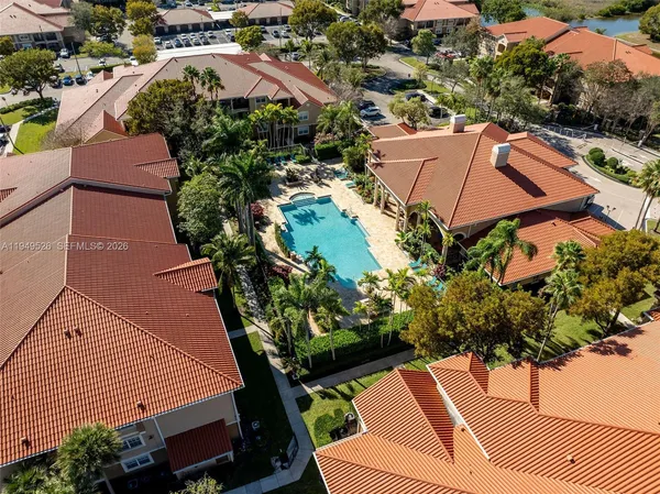 an aerial view of a house with a yard and plants