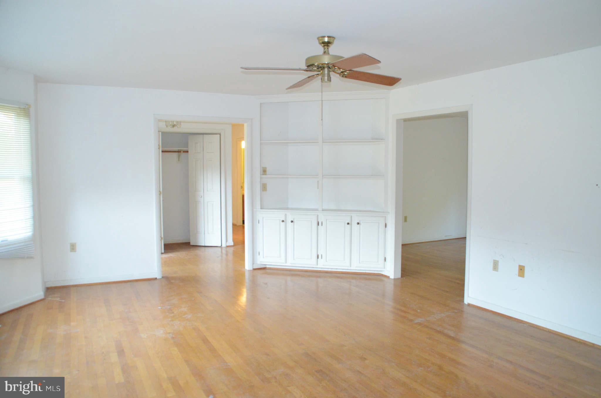6922 Thorneton Road St. Michaels, MD 21663 - Photo 12 of 26 an empty room with cabinet and a chandelier fan