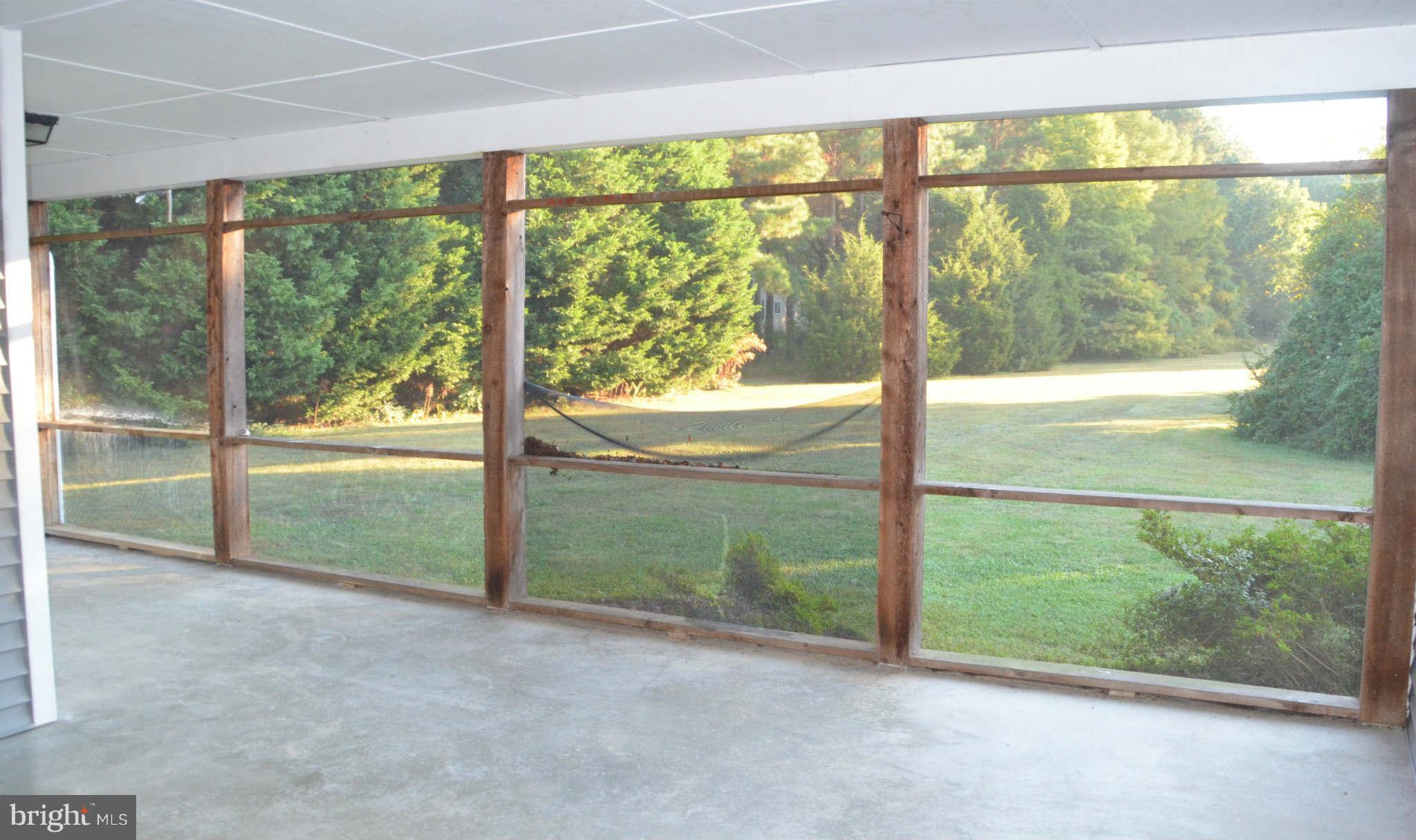 6922 Thorneton Road St. Michaels, MD 21663 - Photo 13 of 26 an empty room with yard and outdoor view