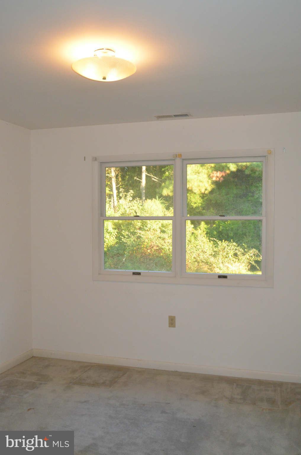 6922 Thorneton Road St. Michaels, MD 21663 - Photo 15 of 26 a view of an empty room with a window