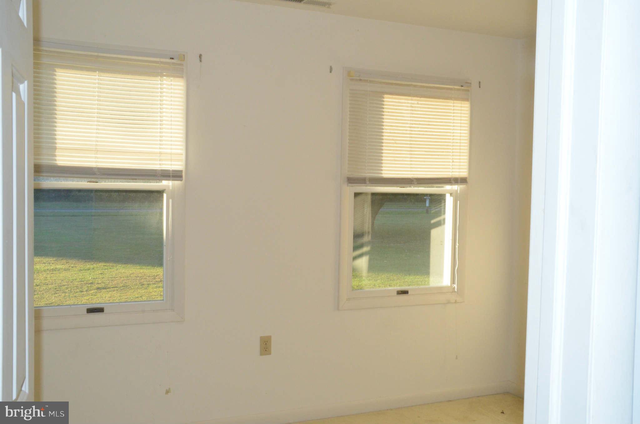 6922 Thorneton Road St. Michaels, MD 21663 - Photo 16 of 26 a bathroom that has a window in it