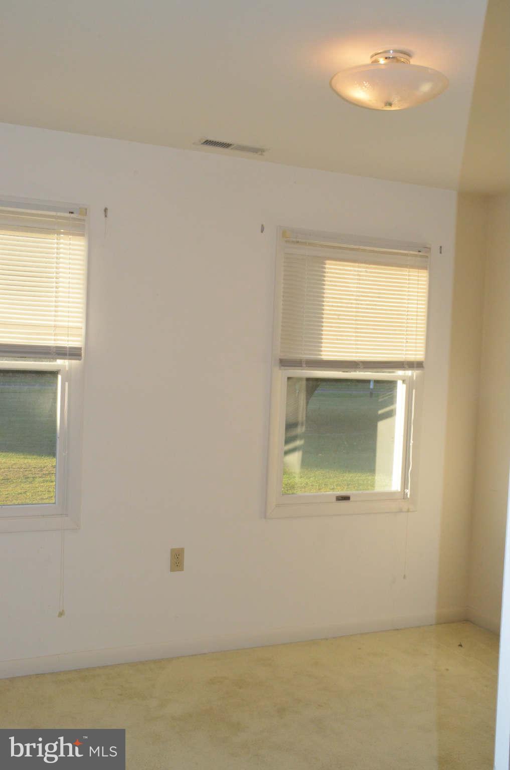 6922 Thorneton Road St. Michaels, MD 21663 - Photo 17 of 26 an empty room with a window