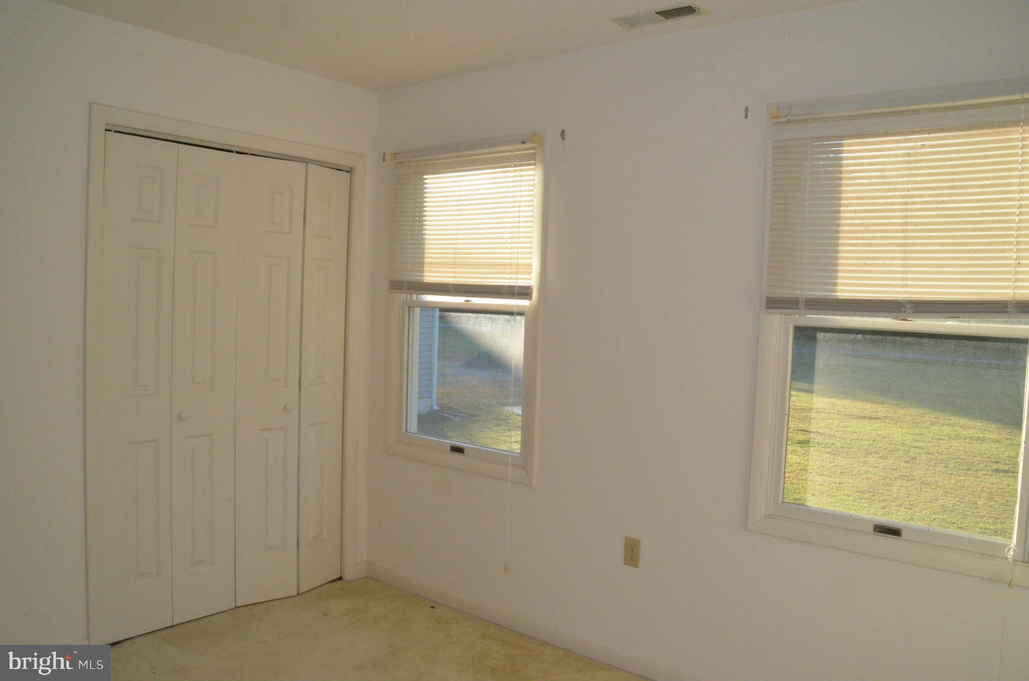 6922 Thorneton Road St. Michaels, MD 21663 - Photo 18 of 26 a view of an empty room with a window