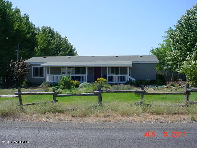 3240 Rosenkranz Road Tieton, WA 98947 - Photo 1 of 14 a view of a house with a yard and a garden