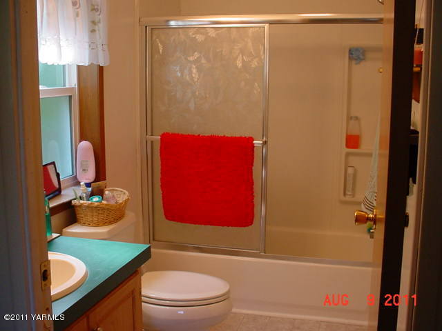 3240 Rosenkranz Road Tieton, WA 98947 - Photo 10 of 14 a bathroom with a sink toilet and shower