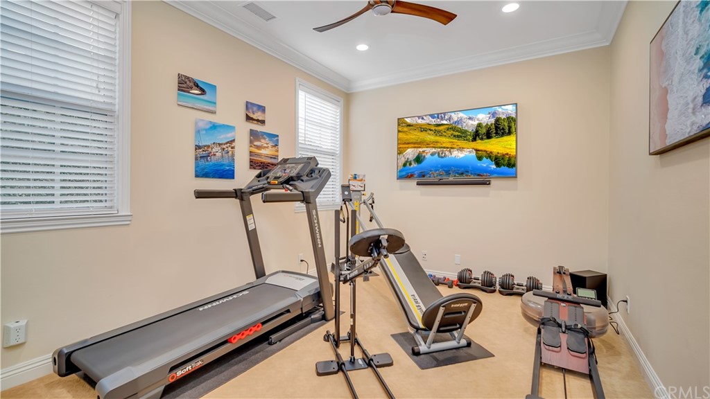 3 Adele Street Ladera Ranch, CA 92694 - Photo 24 of 42 Downstairs, tucked behind the kitchen is the 5th bedroom. Currently used as a workout room, you have no excuses to miss a workout.