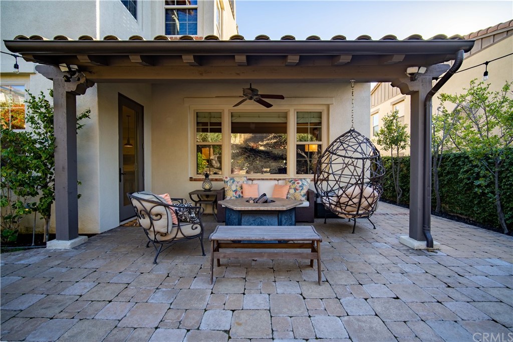 3 Adele Street Ladera Ranch, CA 92694 - Photo 26 of 42 a backyard of a house with barbeque oven table and chairs