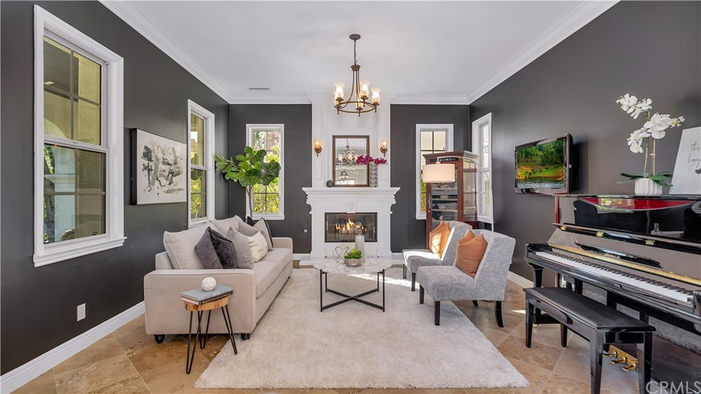 3 Adele Street Ladera Ranch, CA 92694 - Photo 3 of 42 a living room with furniture fireplace and flat screen tv