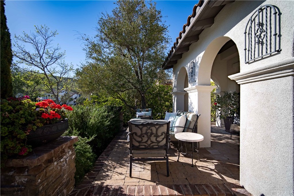 3 Adele Street Ladera Ranch, CA 92694 - Photo 32 of 42 This is the expanded area of the front porch. Lush softscape and speciman trees create a private oasis.