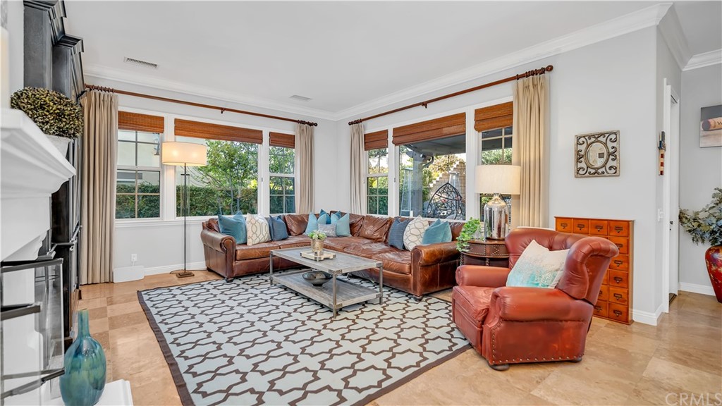 3 Adele Street Ladera Ranch, CA 92694 - Photo 35 of 42 a living room with furniture and a large window