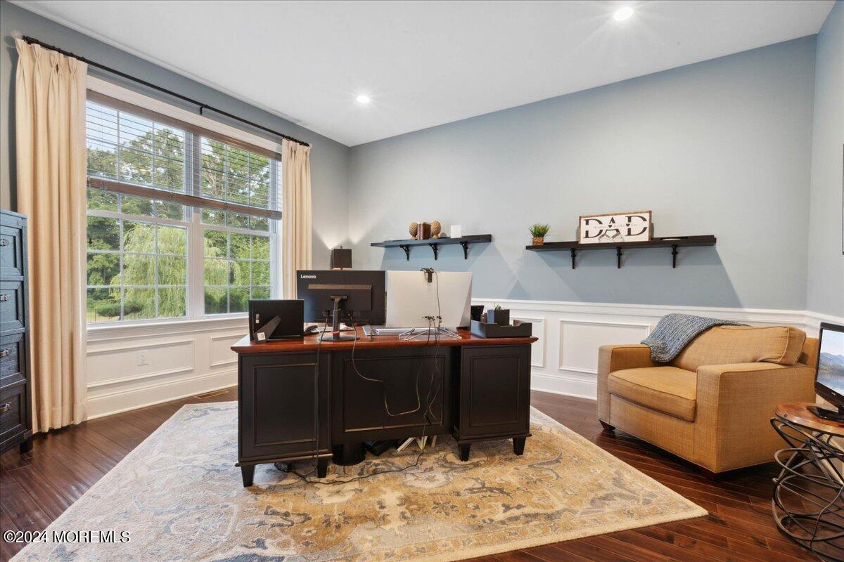 34 Windermere Road Lincroft, NJ 07738 - Photo 16 of 78 a living room with furniture and a fireplace