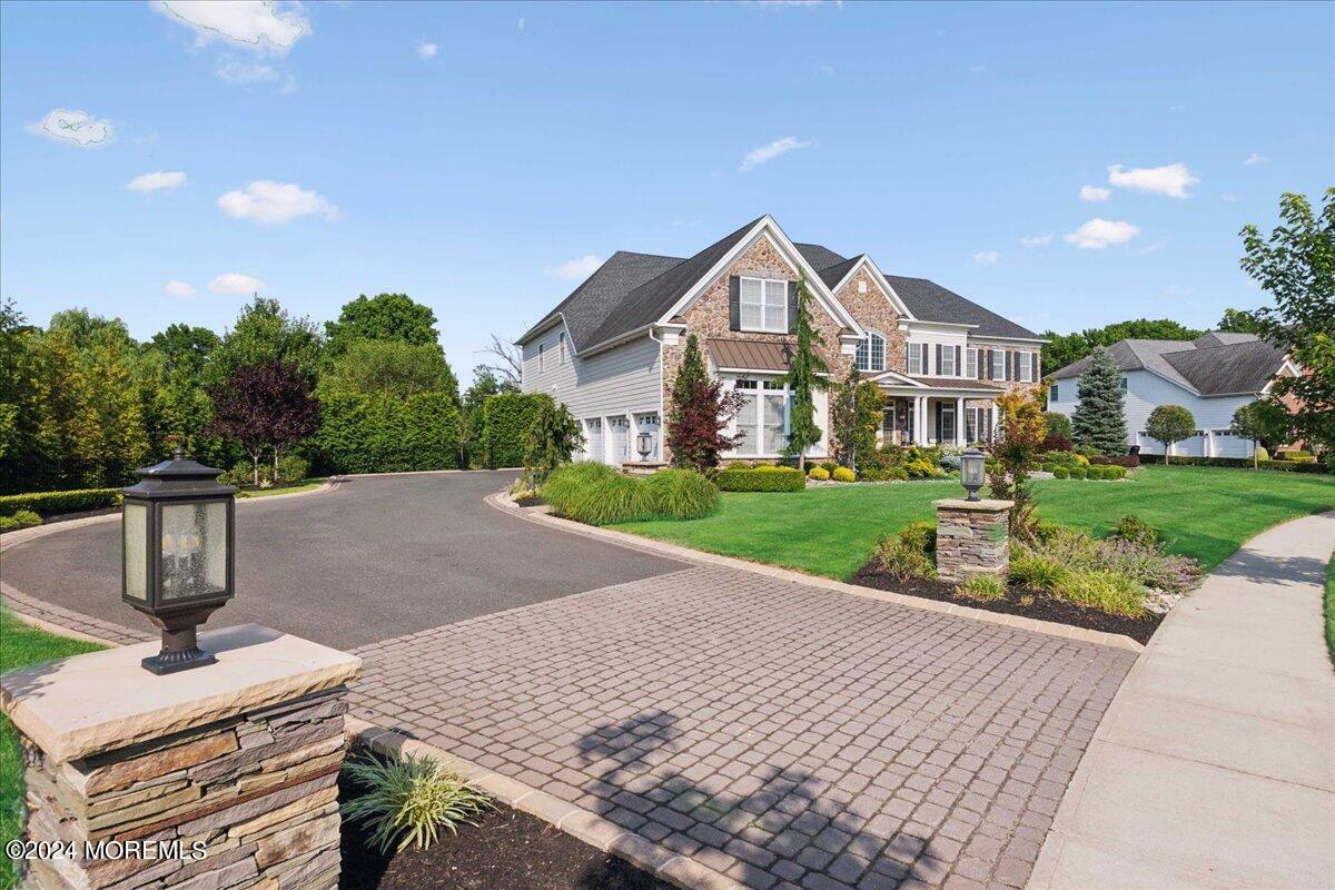 34 Windermere Road Lincroft, NJ 07738 - Photo 2 of 78 a front view of a house with garden