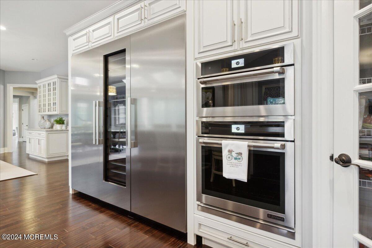 34 Windermere Road Lincroft, NJ 07738 - Photo 26 of 78 a kitchen with granite countertop stainless steel appliances and wooden floor