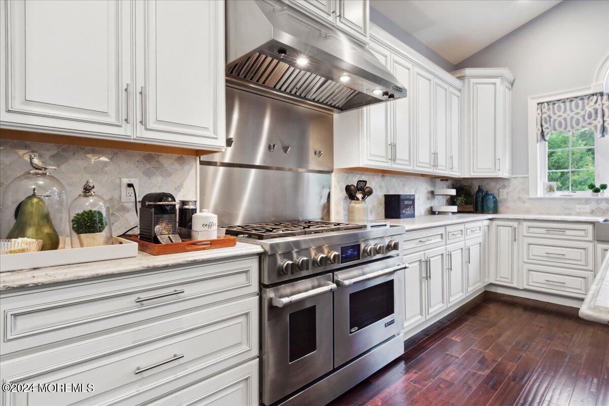 34 Windermere Road Lincroft, NJ 07738 - Photo 27 of 78 a kitchen with stainless steel appliances granite countertop a sink and cabinets